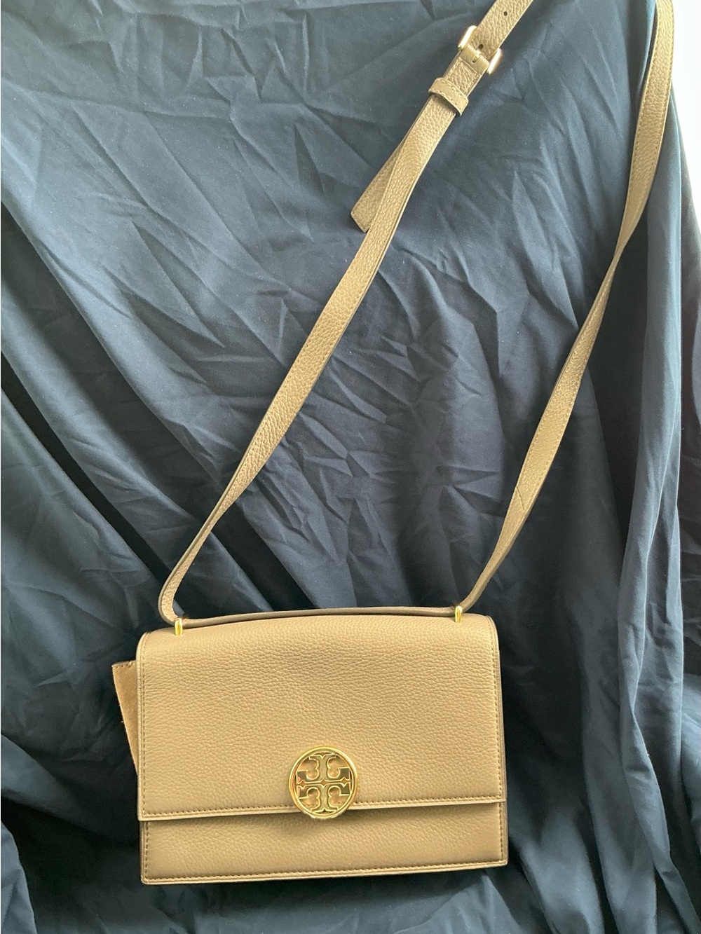 Tory Burch Pebbled Leather Crossbody with Gold Logo. Color is Mushroom